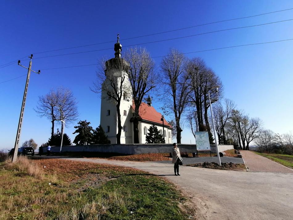 a woman standing in front of a building