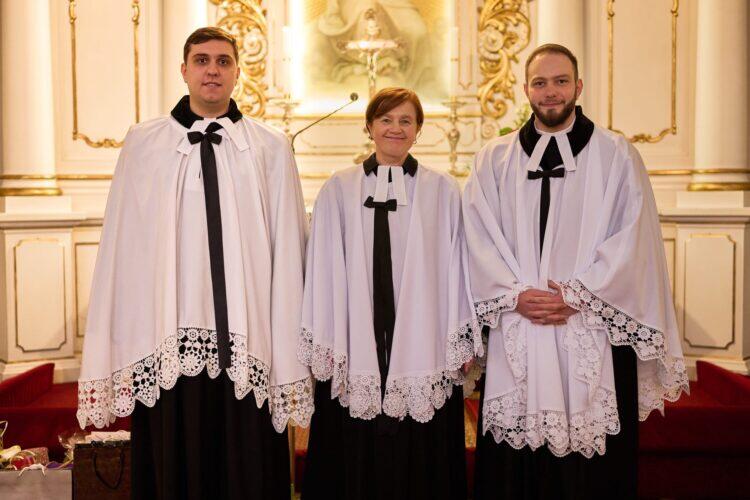 a group of people wearing robes